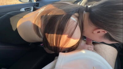 Girl friend fucked in the mouth of a car in a public parking lot