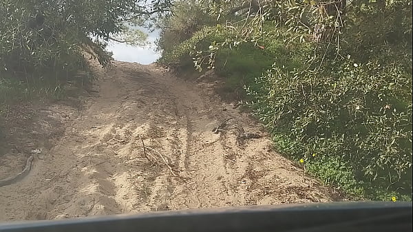 guy of car spills a lot of milk on a trail near the sea
