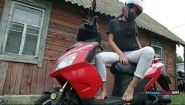 Russian biker girl plays with her wet pussy outdoors.