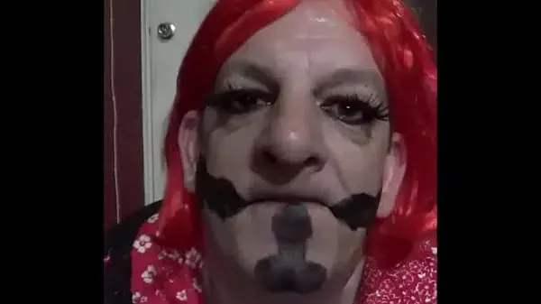 bisexual crossdressing gay mark wright has painted cocks on his face while he licks his cum clean of his hand and shows you it in his mouth afterwards